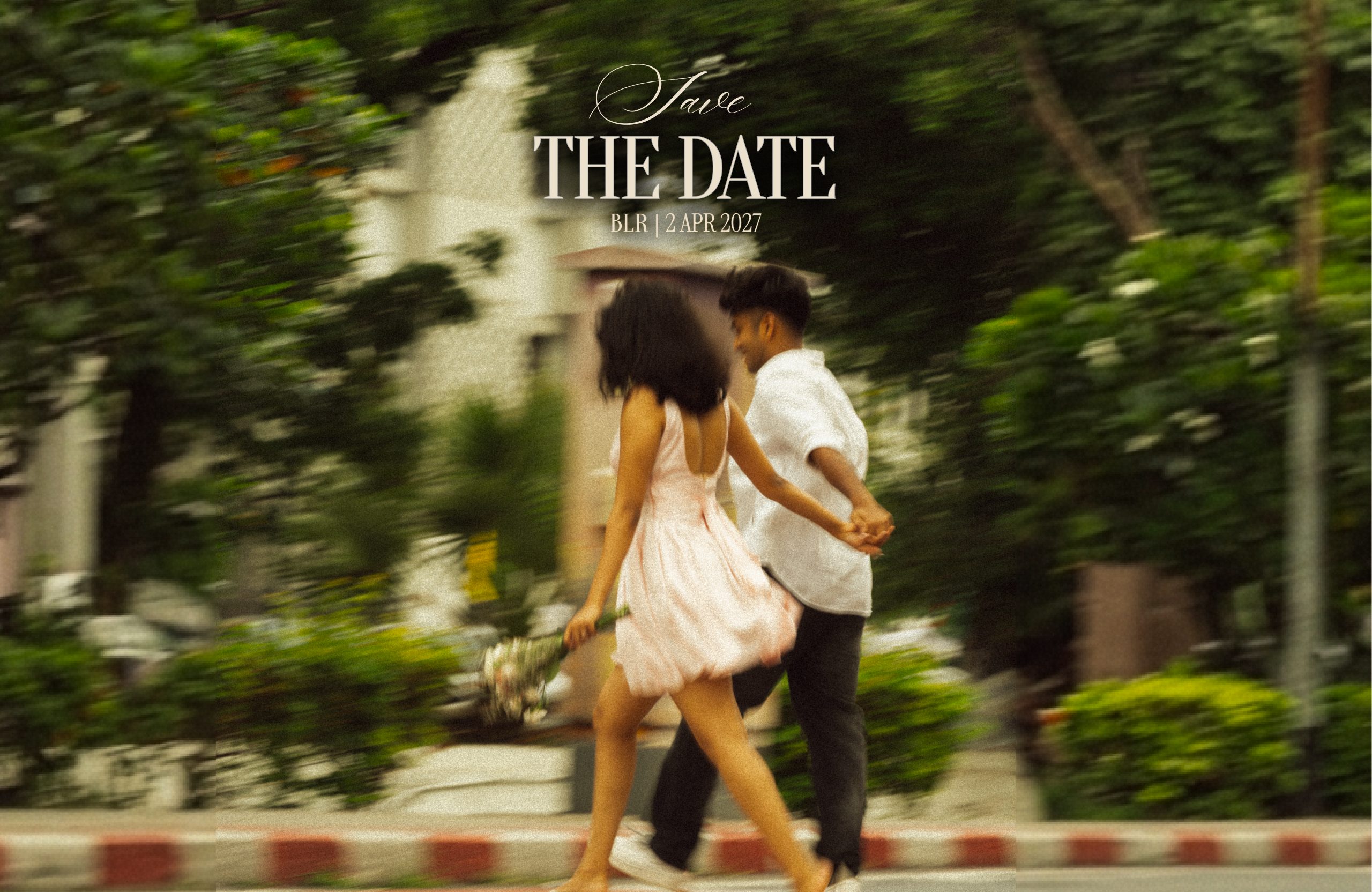 Save the date — Saha and Andrews, Bangalore, 2 April 2027. The two of them crossing a street hand in hand.